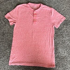 Salmon color tshirt, size small, no holes or tears.